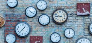 Several clocks on a wall