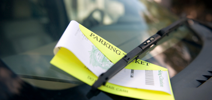 A parking ticket on a windshield
