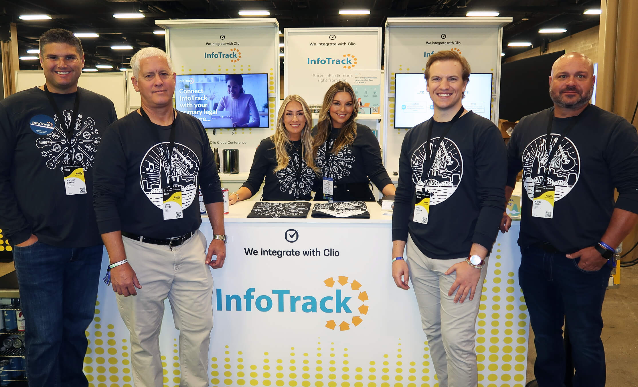 Team members in front of a trade show booth